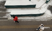 元宵节清晨北京现今年第4场雪 积雪明显道路滑